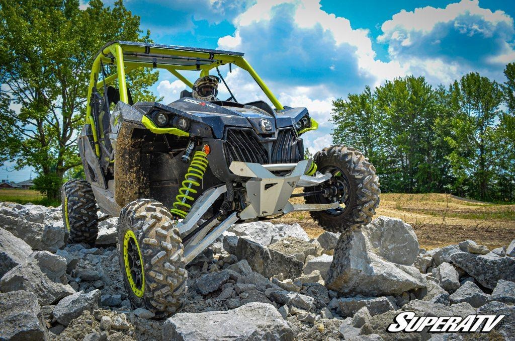 A UTV with independent suspension navigating a rocky trail